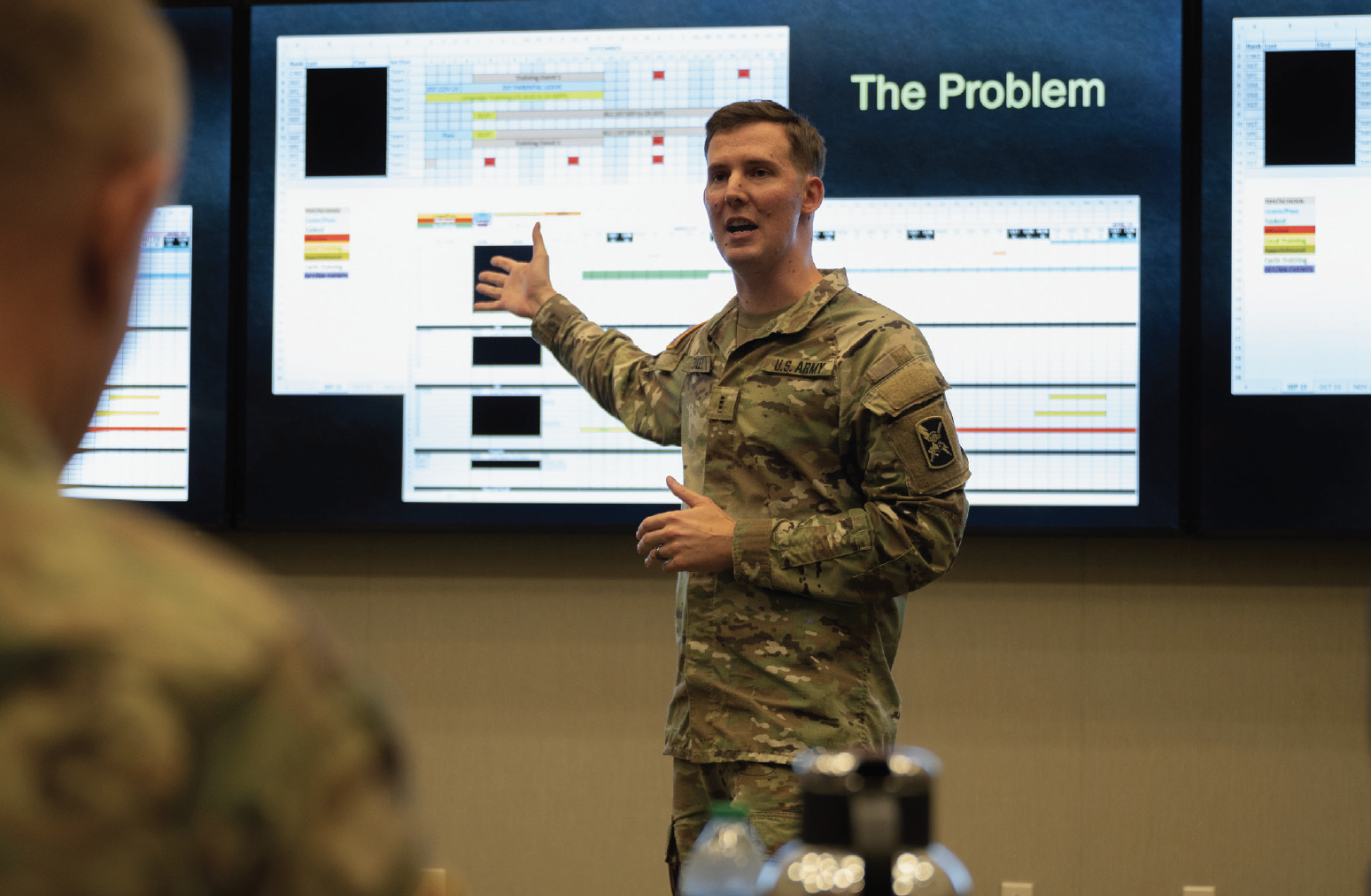 Army Chief Warrant Officer 3 Steven Staley, assigned to 202nd Military Intelligence Battalion, presents his troop to task invention during ARCENT ideas for innovation 23 at Patton Hall, Shaw Air Force Base, South Carolina, October 2, 2023 (U.S. Army/Amber Cobena)